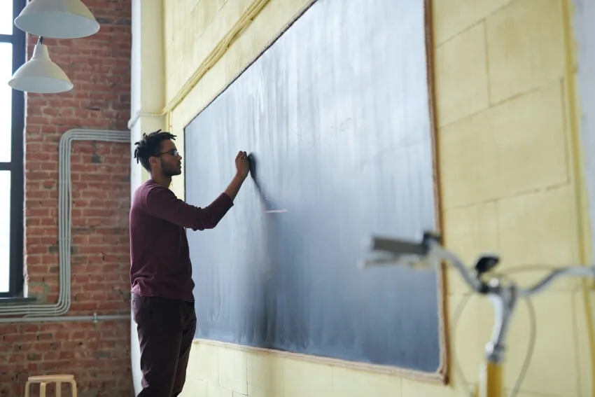 Teacher Writing on a Board