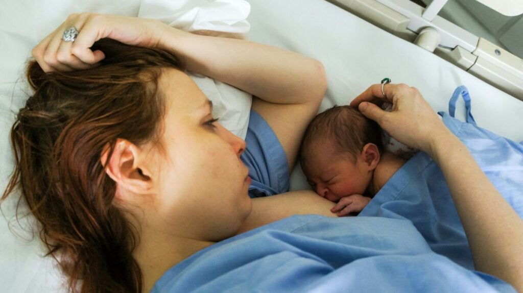 Woman breastfeeding her newborn baby